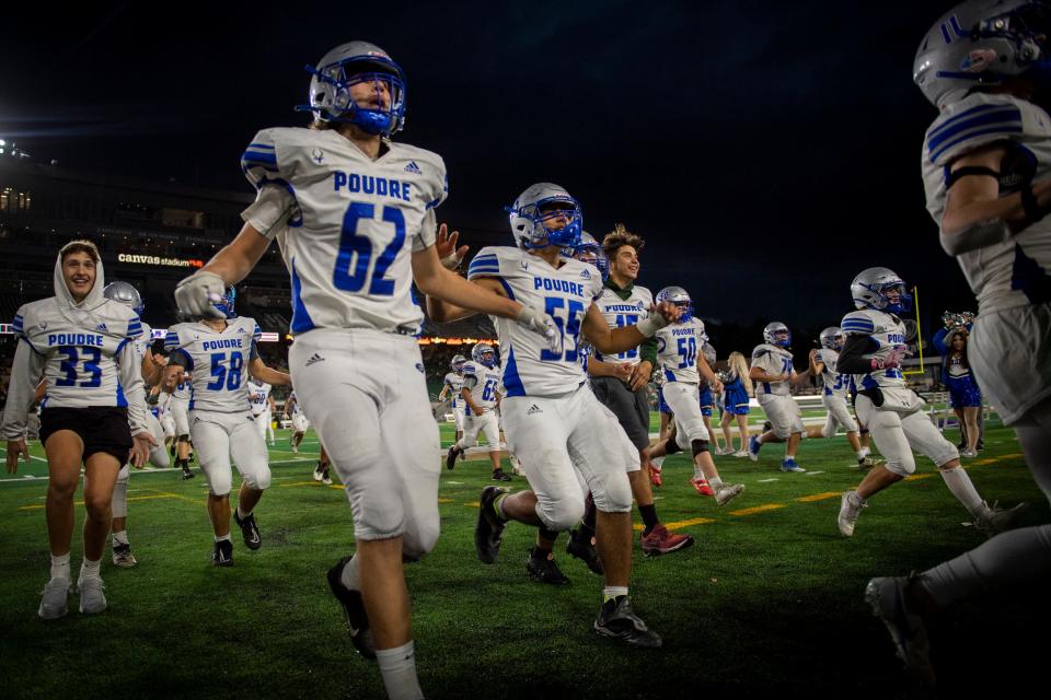 Poudre High School celebrates their 34-7 win over Rocky Mountain High School during the Canvas Community Classic at Canvas Stadium in Fort Collins, Colo. on Friday, Sept. 30. 2022.