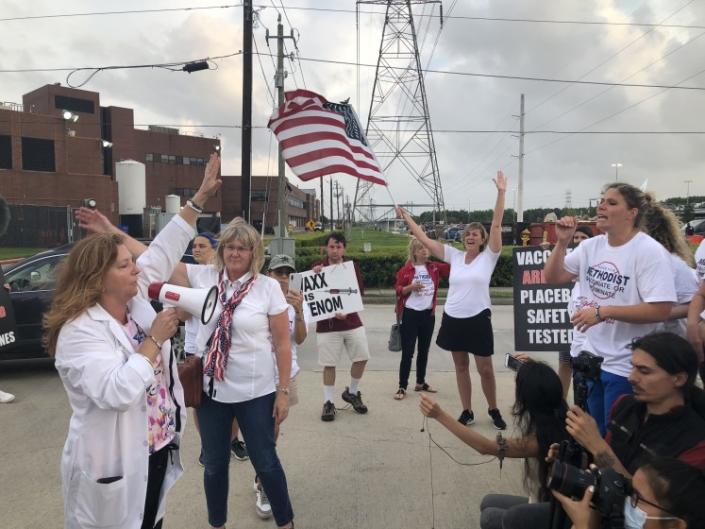 Houston Methodist Hospital nurse Jennifer Bridges (right) leads a COVID vaccine protest this month.