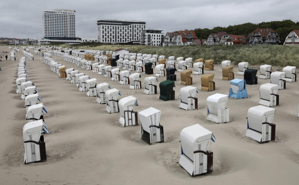 Beach chairs placed in lines at the Baltic Sea beach in Warnemuende, Germany, May 25, 2020. Germany's northern states are starting to reopen the touristic hotspots after the lockdown because of the coronavirus crisis and hope that German tourists will come. (Bernd Wuestneck/dpa via AP)