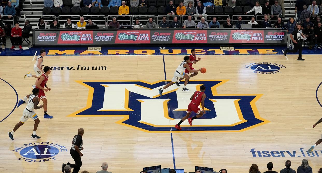 Marquette guard Stevie Mitchell (4) bring the ball up during the second half of their game against Northern Illinois Monday, November 6, 2023 at Fiserv Forum in Milwaukee, Wisconsin. Marquette is playing on a new court this season.