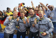 <p>Gold medalists Max Rendschmidt, Tom Liebscher, Max Hoff, and Marcus Gross of Germany pose with their medals for the men’s kayak four 1000m race at Lagoa Stadium in Rio on August 20, 2016. (REUTERS/Murad Sezer) </p>