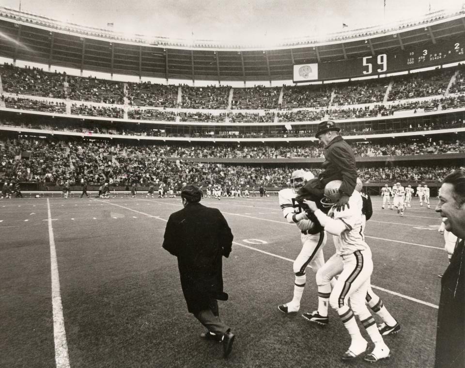 DECEMBER 20, 1970: Proud players carried Paul Brown off the field after the last game at Riverfront Stadium when the Bengals beat the Boston Patriots for the AFL Central title.