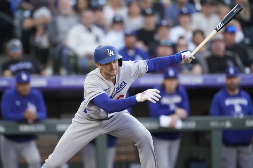 Los Angeles Dodgers' Trea Turner swings at a pitch from Colorado Rockies.