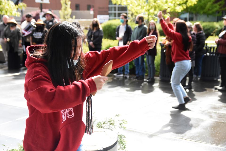 Lavonne Tom, Port Gamble S'Klallam Tribe member, dances and sings at an event celebrating the installation of Lushootseed language markers at Olympic College's campus in Bremerton on Thursday.