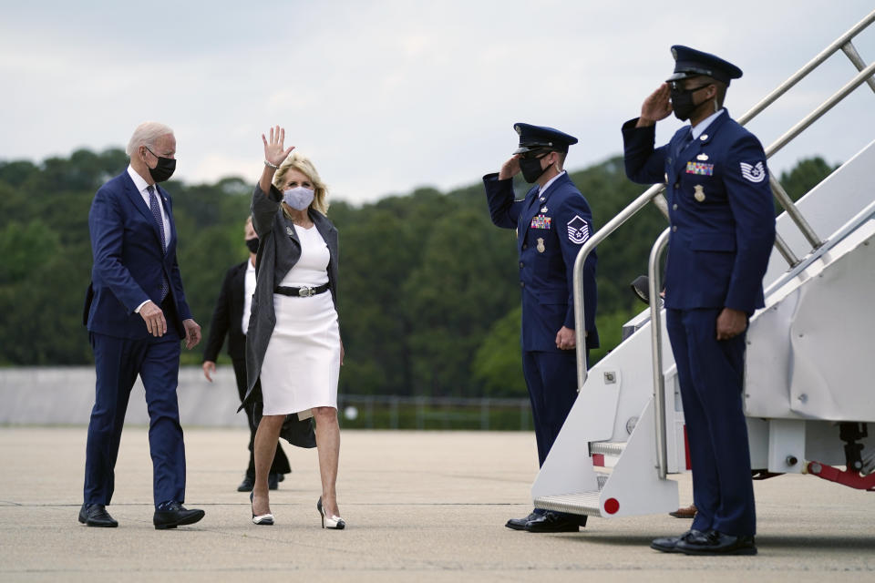 President Joe Biden and first lady Jill Biden wave as they board Air Force One to depart at the Newport News/Williamsburg International Airport, Monday, May 3, 2021, in Newport News, Va. They traveled Monday to coastal Virginia to promote his plans to increase spending on education and children, part of his $1.8 trillion families proposal announced last week. (AP Photo/Evan Vucci)