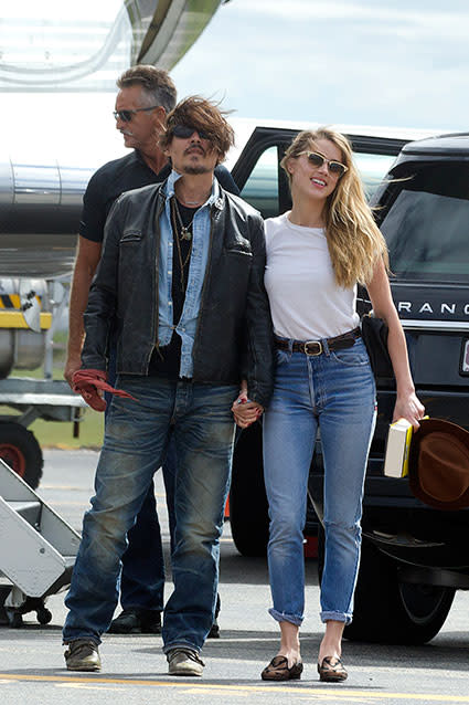 What split? Johnny Depp and Amber Heard held hands in Brisbane, Australia on Monday, putting on a united front in the face of rumors that the two were already headed towards a split after tying the knot in February. <em>People</em> also reported on Monday that the two were leading "separate lives," but has since deleted the post. Johnny, 51, and Amber, 28, however, proved that they're still very much together, showing some PDA in Australia where Johnny's filming <em>Pirates of the Caribbean: Dead Men Tell No Tales</em>. This is the first time the two have been photographed together since their wedding. Splash News PHOTOS: Sweetest Celebrity PDA "They've always been together," a source explains to E! News. "They travel for work then come home. They live together and are very much in love, despite what's being said about breakup rumors." "They are very much in love with each other, but because of their strong personalities and opinions, they do argue a lot," an insider adds. Regardless of any supposed marital drama, the two looked every bit the movie stars that they are on Monday, Amber managing to stun in just a pair of high-waist jeans and a simple white t-shirt. Meanwhile, Johnny sported his usual rocker look, sporting disheveled hair, a leather jacket and multiple necklaces. Splash News VIDEO: Johnny Depp's 15-Year-Old Daughter Lily-Rose Depp Is All Grown-Up in a Crop Top Check out the video below to hear Johnny admit he'd like to have "100" more kids with Amber, in addition to his two children with his ex Vanessa Paradis, Lily-Rose, 15, and Jack, 13.