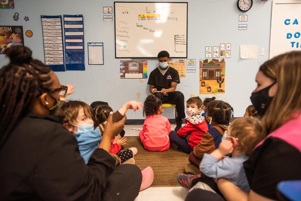 Jahnique Dessaline, the preschool teacher, starts circle time with students at Victoria's Castle Daycare in New Windsor on January 21, 2022.