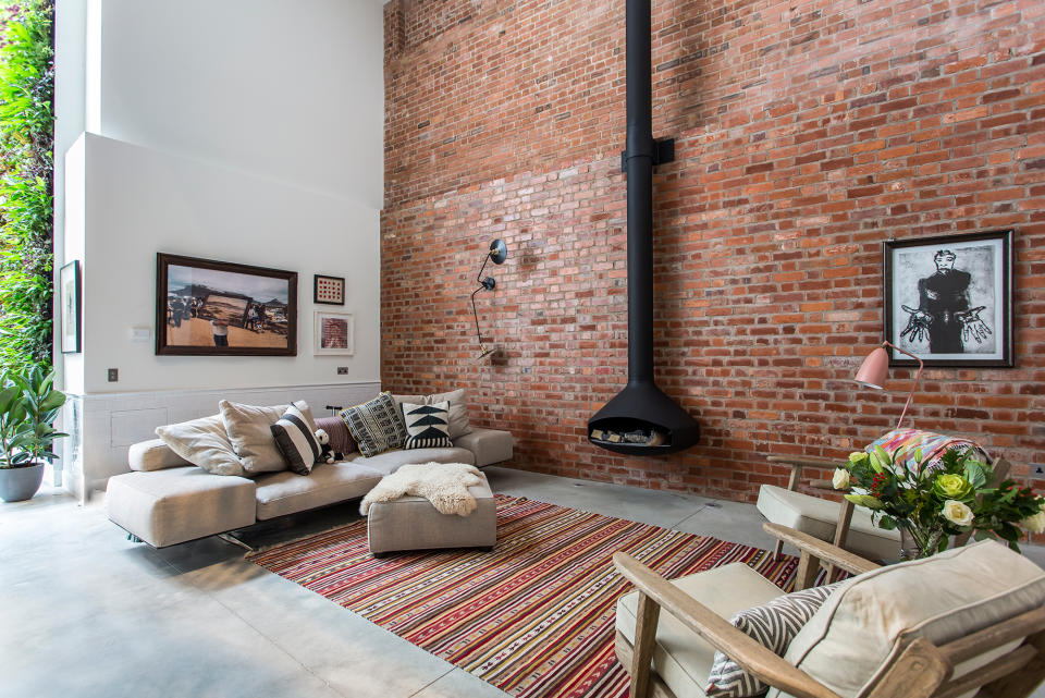 <p><strong>Location:</strong> Clerkenwell, London</p> <p>Formerly a barrel-making factory, this sprawling home features a sitting room with an exposed brick wall and an atrium of climbing plants.</p> <p>For more info, visit <a rel="nofollow noopener" href="https://www.onefinestay.com/homes/london/clerkenwell-cooperage/" target="_blank" data-ylk="slk:onefinestay.com;elm:context_link;itc:0;sec:content-canvas" class="link ">onefinestay.com</a></p>