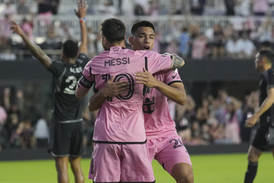Inter Miami midfielder Diego Gómez (20) congratulates forward Lionel Messi (10) for a goal during the first half of the team's MLS soccer match against Nashville SC, Saturday, April 20, 2024, in Fort Lauderdale, Fla. (AP Photo/Marta Lavandier)