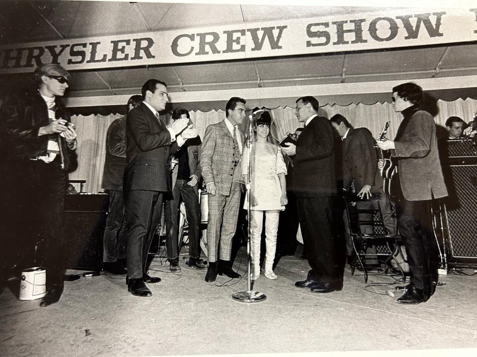 Judge David L. Golden conducts the Mod Wedding ceremony for groom Gary Norris and bride Randy McNair in front of Andy Warhol, left, best man Scott Regen, the WKNR deejay; and Velvet Underground frontman Lou Reed, right, with guitar.