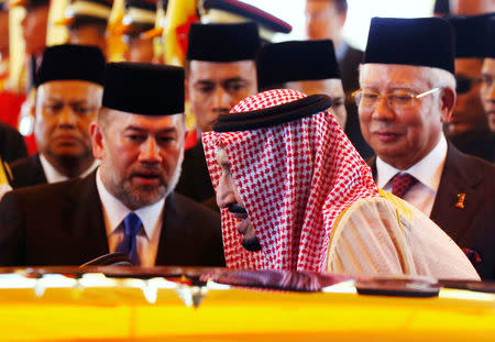 Saudi Arabia's King Salman leaves after inspecting an honour guard with Malaysia's Prime Minister Najib Razak (R) and Malaysia's King Muhammad V (L) at the Parliament House in Kuala Lumpur, Malaysia February 26, 2017. REUTERS/Edgar Su