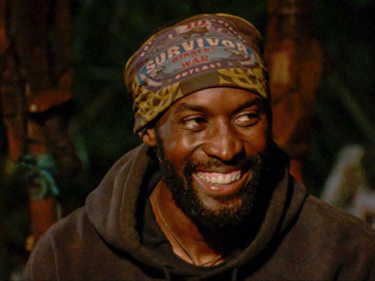 Jeremy Collins, a man smiling and wearing a "Survivor" hat