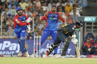 Delhi Capitals' captain Rishabh Pant, left, appeals unsuccessfully for the stumping of Gujarat Titans' Rahul Tewatia during the Indian Premier League cricket match between Delhi Capitals and Gujarat Titans in Ahmedabad, India, Wednesday, April 17, 2024. (AP Photo/Pravin Indrekar)