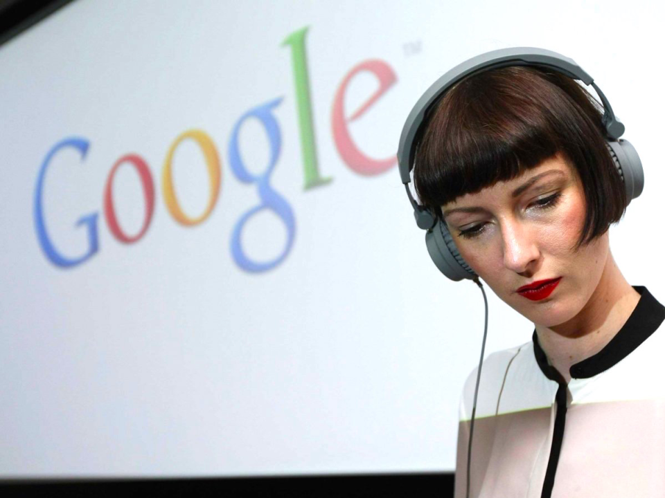 A woman listening to her headphones.