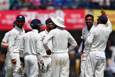 Cricket - India v New Zealand - Third Test cricket match - Holkar Cricket Stadium, Indore, India - 10/10/2016. India's Ravichandran Ashwin celebrates with teammates after the wicket of New Zealand's Ross Taylor. REUTERS/Danish Siddiqui