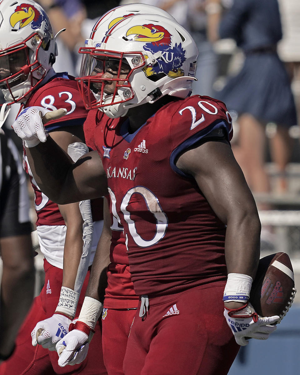 Kansas running back Daniel Hishaw Jr. (20) celebrates after scoring a touchdown during the first half of an NCAA college football game against Duke Saturday, Sept. 24, 2022, in Lawrence, Kan. (AP Photo/Charlie Riedel)