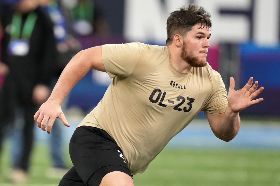 Former West Virginia center Zach Frazier performs limited drills during the NFL Combine. He's waiting until his pro day to show scouts he's healthy again.
