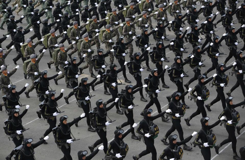 Members of South Korea's Underwater Demolition Team (UDT) march during the 65th anniversary of Korea Armed Forces Day, at a military airport in Seongnam, south of Seoul, October 1, 2013. (REUTERS/Kim Hong-Ji)