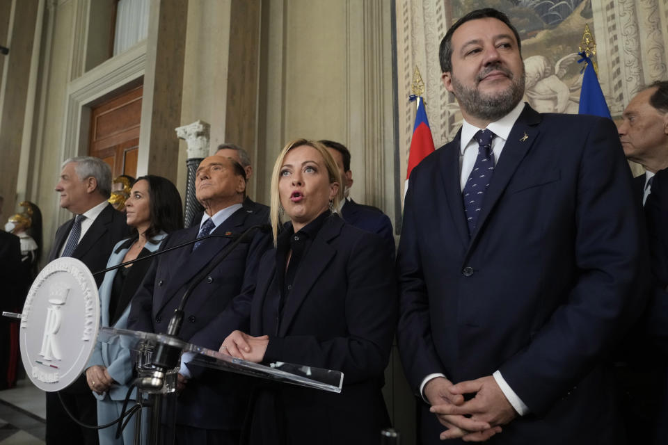 Brothers of Italy's leader Giorgia Meloni is flanked by The League leader Matteo Salvini, right, Forza Italia president Silvio Berlusconi, Senator Licia Ronzulli and Antonio Tajani as she talks to the press at the Quirinale Presidential Palace after a meeting with Italian President Sergio Mattarella as part of a round of consultations with party leaders to try and form a new government, in Rome, Friday, Oct. 21, 2022. (AP Photo/Gregorio Borgia)