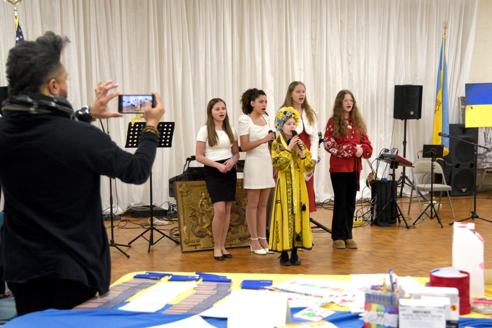 Children sing the Ukrainian national anthem during a fundraiser on Sunday, February 25, 2024 at St. Stephen Ukrainian Catholic Church in Toms River, New Jersey.