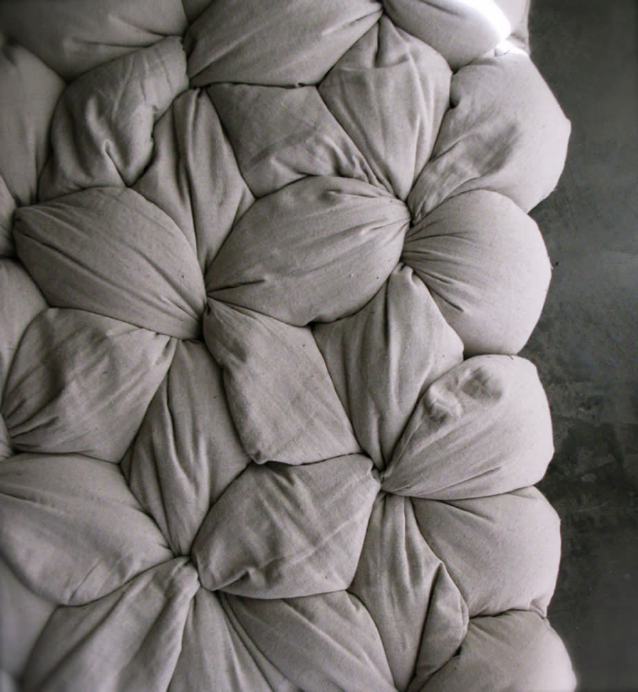 This undated publicity image provided by OpenYourEyesBedding.com shows fa detail of former interior designer Lynn Cimino's original Twist mattress design – components include cotton covers and buckwheat hulls that you self-assemble by filling the covers with the hulls and twisting and tying. Fully customizable, the mattresses are similar to Japanese futons. (AP Photo/OpenYourEyesBedding.com)