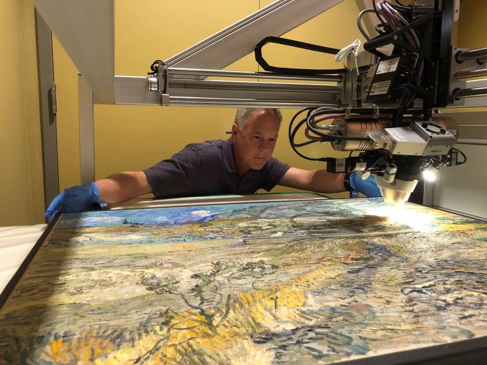 Jeff Fieberg analyzes Vincent Van Gogh's Landscape at Saint-Rémy in summer 2021 at the Indianapolis Museum of Art.