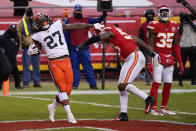 Cleveland Browns running back Kareem Hunt (27) celebrates in front of Kansas City Chiefs linebacker Anthony Hitchens, right, after scoring on a 3-yard touchdown run during the second half of an NFL divisional round football game, Sunday, Jan. 17, 2021, in Kansas City. (AP Photo/Jeff Roberson)