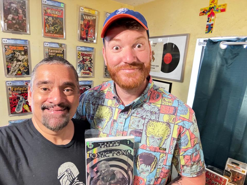 FLORIDA TODAY Engagement Editor John A. Torres and his son, Daniel, pose with the first issue of their comic book "Tales from Toxic Pond." The duo started their own comic book company in 2023 called Space Chimp Comics.
