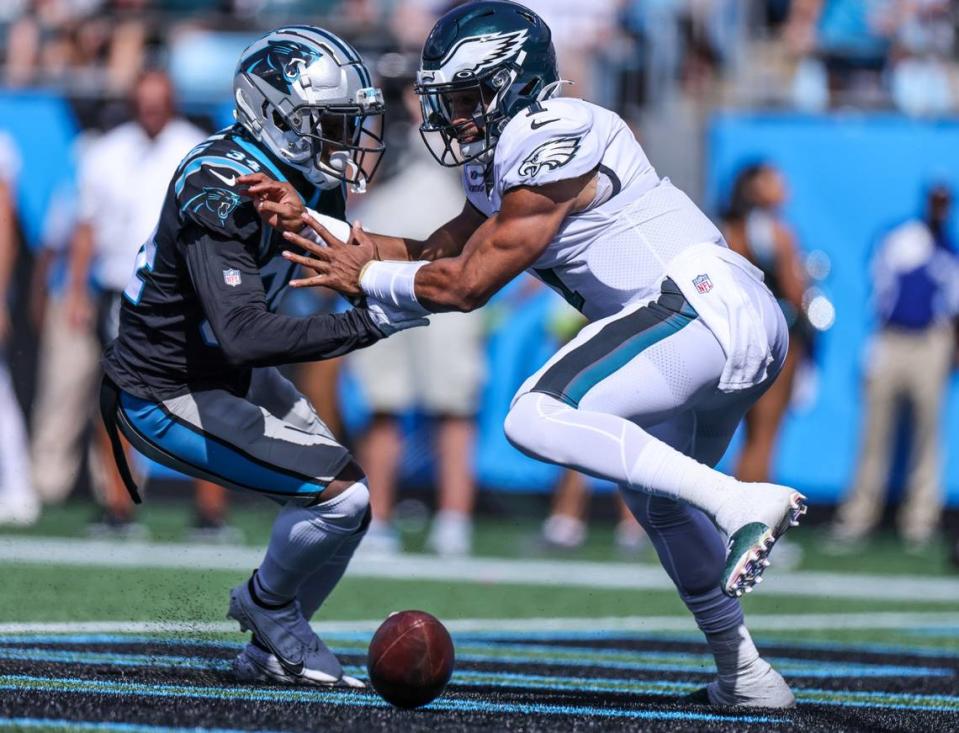 Carolina Panther safety Sean Chandler, left, and Philadelphia’s Jalen Hurts scramble for a loose ball at Bank of America Stadium on Oct. 10th.