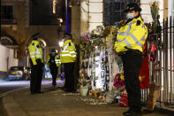 Police officers patrol outside the Myanmar Embassy in London, Wednesday, April 7, 2021. Newspaper reports say the embassy was taken over by members of the country's new military regime Wednesday evening. (AP Photo/Alberto Pezzali)