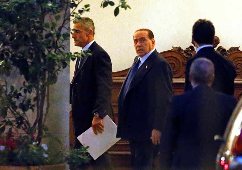 FILE PHOTO: Silvio Berlusconi leaves his residence at Grazioli palace, downtown Rome