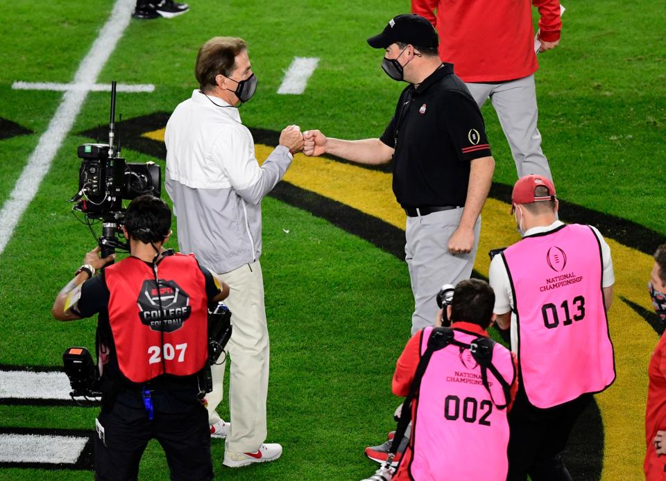 Ohio State's Ryan Day, right, didn't often go head-to-head with now-retired Alabama football coach Nick Saban, left. Day instead decided to focus on more winnable battles.