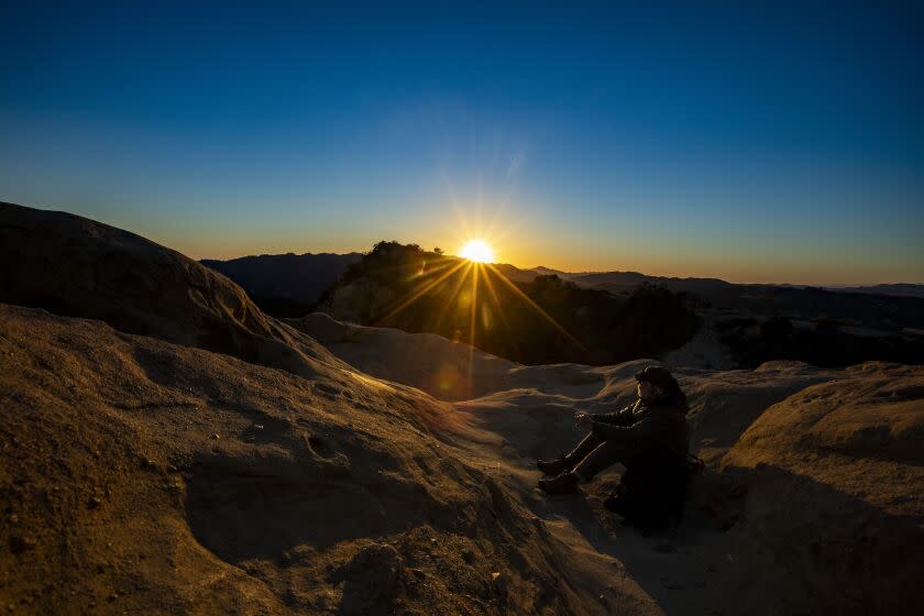 TOPANGA, CA - FEBRUARY 17: The suns sets behind the Santa Monica Mountains in a view from Eagle Rock along the Backbone Trail in Topanga State Park on Wednesday, Feb. 17, 2021 in Topanga, CA. (Brian van der Brug / Los Angeles Times)