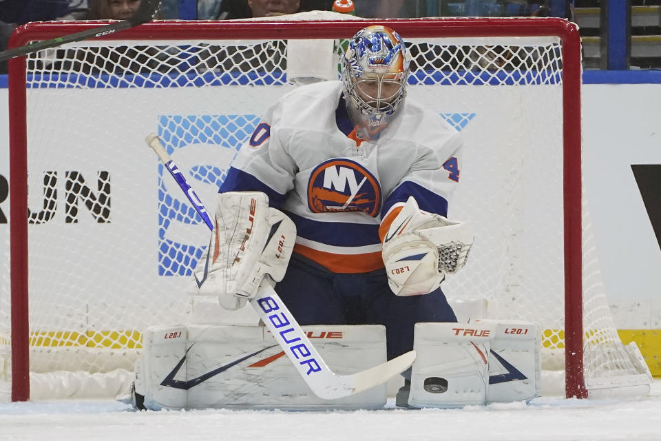 New York Islanders goaltender Semyon Varlamov (40) makes a save on a shot by the Tampa Bay Lightning during the first period in Game 1 of an NHL hockey Stanley Cup semifinal playoff series Sunday, June 13, 2021, in Tampa, Fla. (AP Photo/Chris O'Meara)