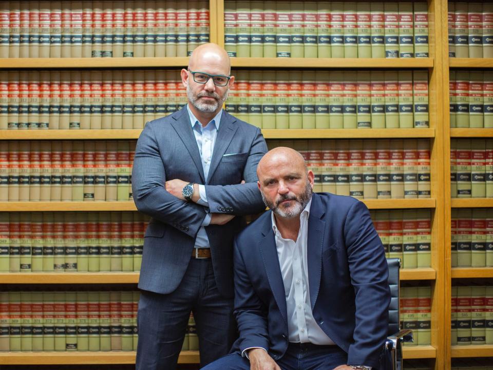 Pictured are attorney and former prosecutor Jeremy Saland, standing, and private investigator Herman Weisberg, a former NYPD detective. Based in Manhattan, the two collaborate in fighting "sextortions" targeting wealthy clients.