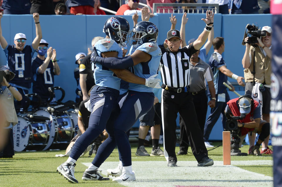 Tennessee Titans tight end MyCole Pruitt, left, celebrates after scoring a touchdown against the Kansas City Chiefs in the first half of an NFL football game Sunday, Oct. 24, 2021, in Nashville, Tenn. (AP Photo/Mark Zaleski)