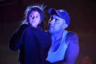 <p>A father and his scared daughter, who were customers inside Walmart, are escorted out of the parking lot and away from the scene of the Walmart store where a shooting occurred inside the store at 9901 Grant Street on Nov. 1, 2017 in Thornton, Colo. (Photo: Helen H. Richardson/The Denver Post via Getty Images) </p>