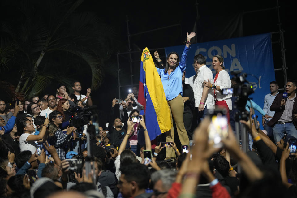 Opposition presidential hopeful Maria Corina Machado celebrates with supporters after listening to the results naming her winner of the opposition primary election, at her campaign headquarters in Caracas, Venezuela, Monday, Oct. 23, 2023. Machado will run against President Nicolás Maduro in the 2024 presidential elections. (AP Photo/Ariana Cubillos)