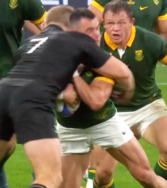 Sam Cane tackling Jesse Kriele in the World Cup final.