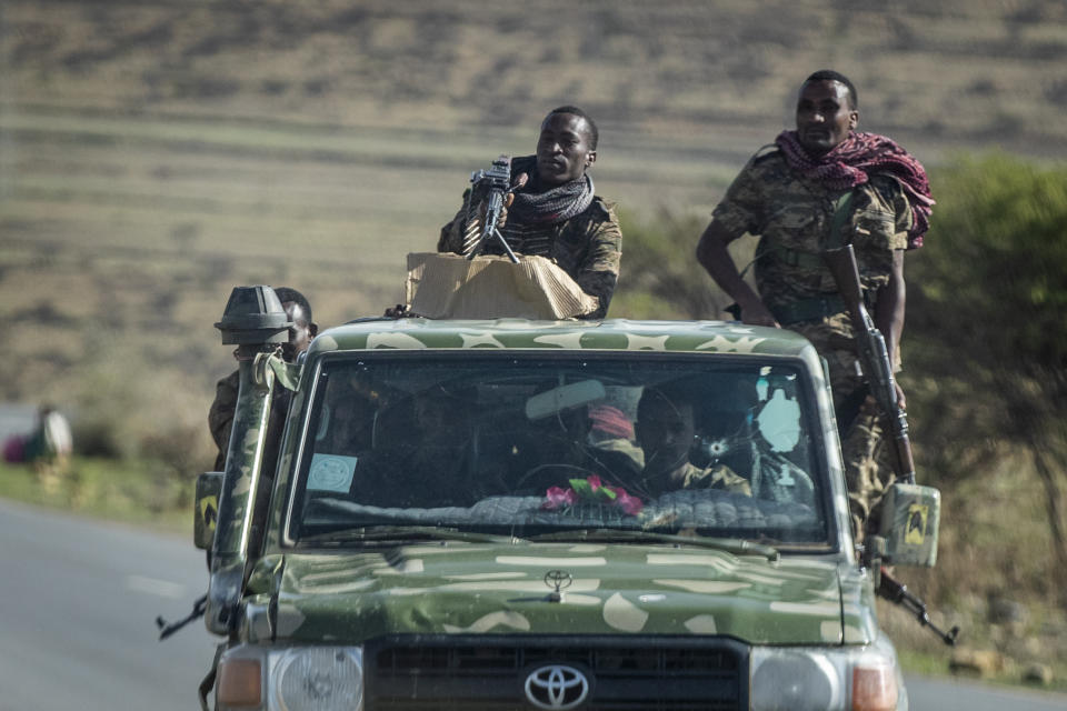 FILE - In this Saturday, May 8, 2021 file photo, Ethiopian government soldiers ride in the back of a truck on a road near Agula, north of Mekele, in the Tigray region of northern Ethiopia. Ethiopia's government said in a statement carried by state media Monday, June 28, 2021, that it has "positively accepted" a call for an immediate, unilateral cease-fire in its Tigray region after nearly eight months of deadly conflict. (AP Photo/Ben Curtis, File)