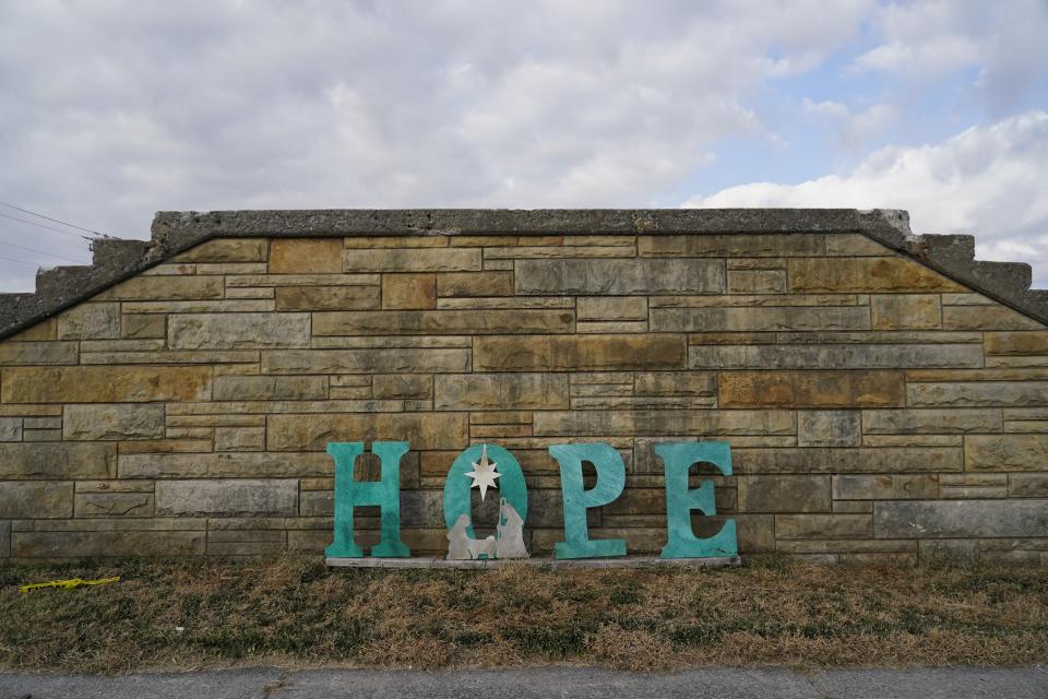 A sign sits in front of the remains of the First Christian Church, Thursday, Nov. 9, 2023, in Mayfield, Ky. In December 2021, a tornado destroyed parts of the town and killed dozens. (AP Photo/Joshua A. Bickel)