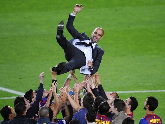 Pep Guardiola lifted a record six trophies with Barcelona in the 2009 season (Getty)