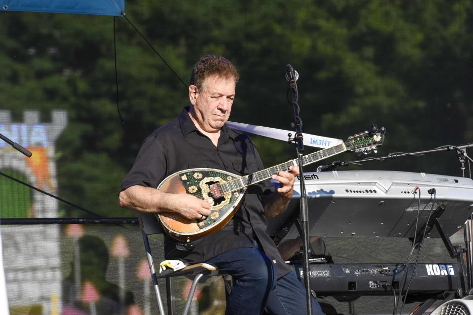 Tehmi Kakias plays the bouzouk at the 2019 Panegyri.