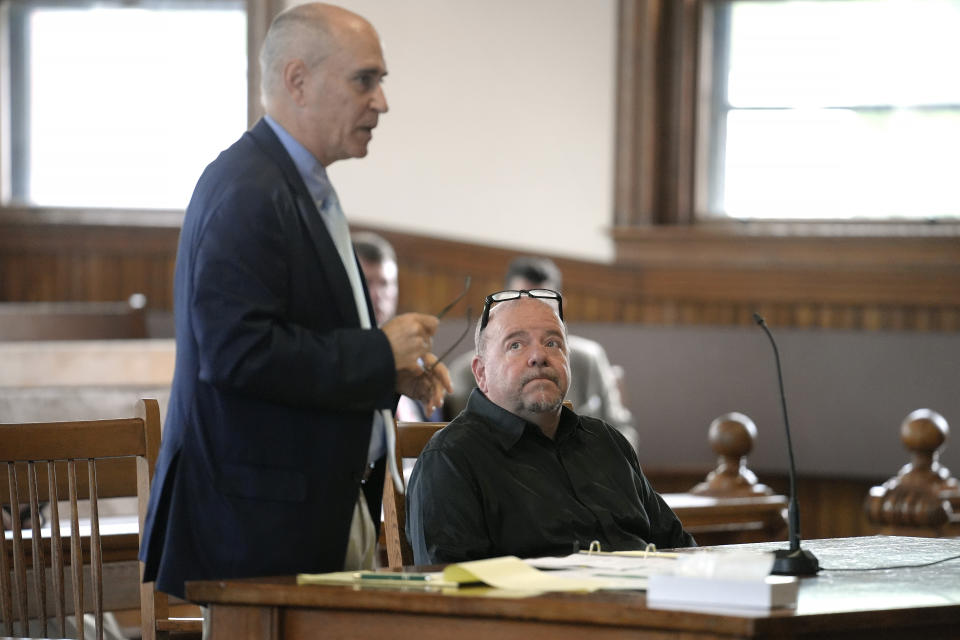 Steve Kramer, right, is seated next to his attorney Tom Reid, left, as Reid addresses the court, Wednesday, June 5, 2024, at superior court, in Laconia, N.H., during Kramer's arraignment in connection with charges of voter suppression and impersonating a candidate. Kramer, a political consultant who sent artificial intelligence-generated robocalls mimicking President Joe Biden's voice to voters ahead of New Hampshire's presidential primary faces more than two dozen criminal charges. (AP Photo/Steven Senne, Pool)