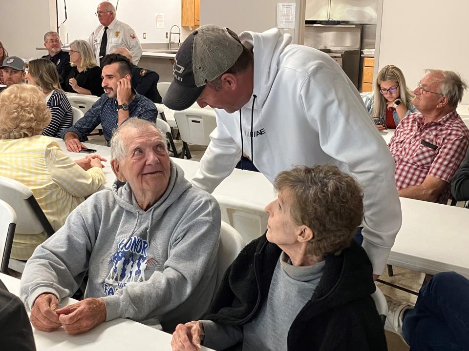 Charlie Miller, standing, chats with Tom and Audrey Moyer during a recent reunion dinner at the Johnsville Fire Department.