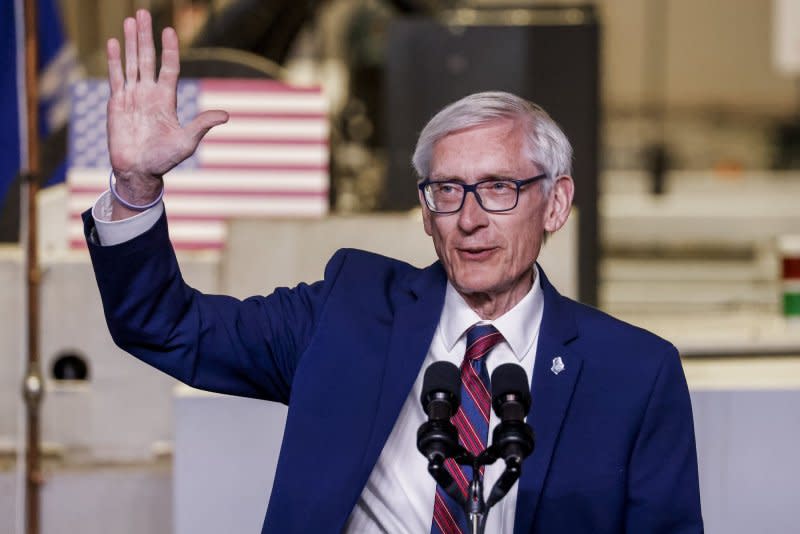 Wisconsin Gov. Tony Evers waves as he speaks before President Joe Biden takes the stage at Gateway Technical College in Sturtevant, Wis., on Wednesday. Photo by Tannen Maury/UPI
