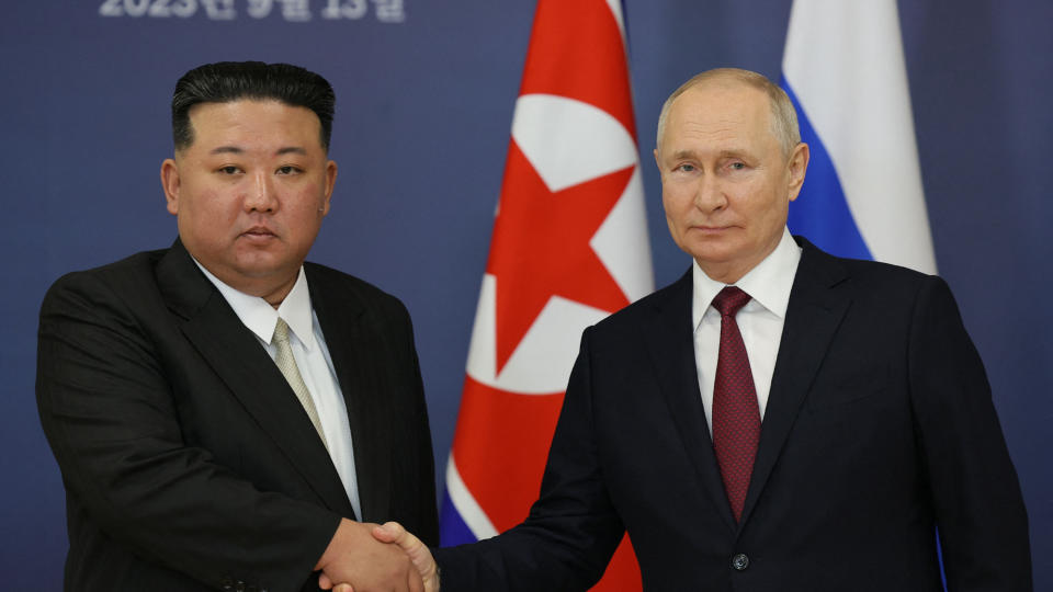 This pool image distributed by Sputnik agency shows Russian President Vladimir Putin (R) and North Korea's leader Kim Jong Un (L) shaking hands during their meeting at the Vostochny Cosmodrome in Amur region on September 13, 2023, ahead of planned talks that could lead to a weapons deal. 