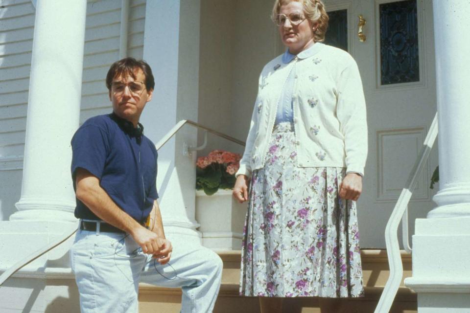 <p>Moviestore/Shutterstock</p> Chris Columbus and Robin Williams on "Mrs. Doubtfire" set.