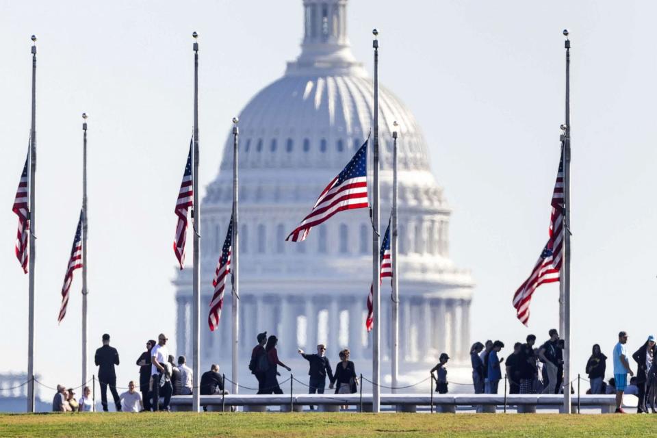 PHOTO: Flags fly at half-staff on the National Mall in Washington, D.C., on Oct 26, 2023 to honor victims of the Oct. 25 mass-shooting in Lewiston Maine. (Jim Lo Scalzo/EPA via Shutterstock)