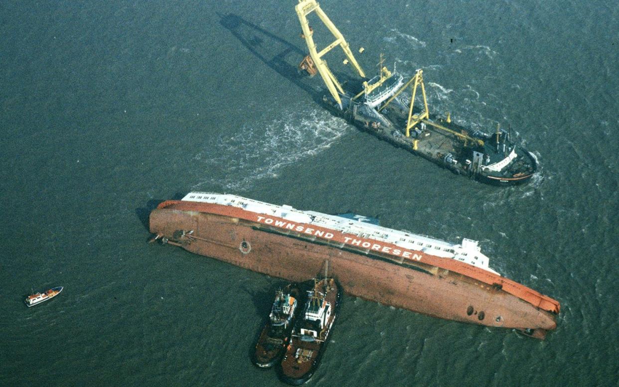 Rescue vessels surrounding the stricken car ferry, which capsized near the entrance to Zeebrugge Harbour, Belgium, on its way to Dover in a tragedy that saw 193 people killed - Press Association Images